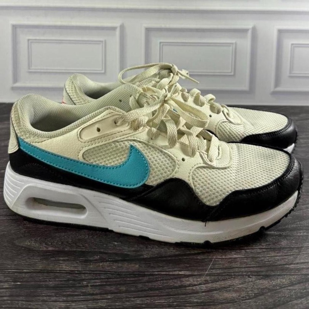 Women's 9.5 Nike Air Max 1 sneakers in cream, black, and blue with blue